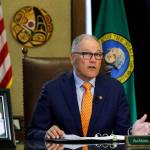 Gov. Jay Inslee sits at his desk and rehearses a speech Tuesday, April 21, 2020, at the Capitol in Olympia minutes before going live to address the public on the states next steps in addressing the coronavirus outbreak. Inslee said the state will not be able to lift many of the stay-at-home restrictions implemented to fight the coronavirus by May 4, the date through which the existing directive is currently in place. (Ted S. Warren/Associated Press)