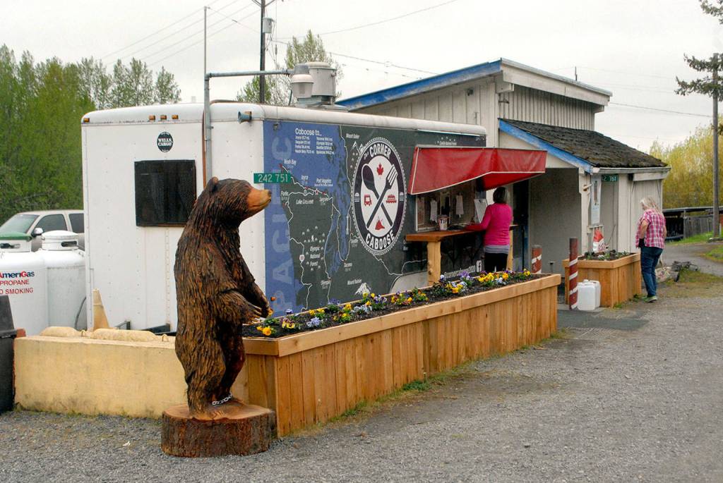 Customers place orders at the Corner Caboose on U.S. Highway 101 near the junction of state Highway 112 west of Port Angeles. (Keith Thorpe/Peninsula Daily News)