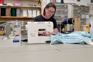 Group steps in to sew reusable hospital gowns