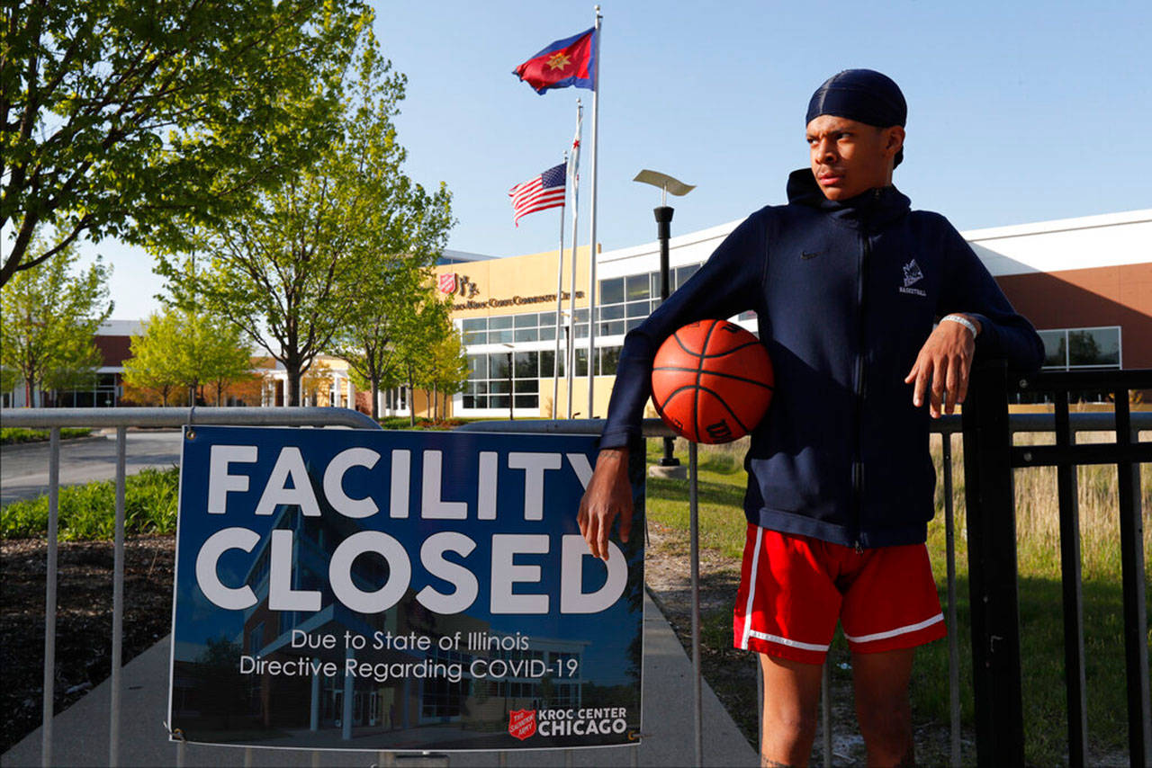 In this Tuesday, May 12, 2020, photo, Saint Wilkins poses for a portrait outside The Salvation Armys Ray and Joan Kroc Corps Community Center on Chicagos Southside. Growing up in a rough part of Chicagos South Side, Wilkins figured he was headed for a life on the streets. If it wasnt for the Kroc Center, Id be gang-banging, Wilkins said. I promise you that. (Charles Rex Arbogast/Associated Press)