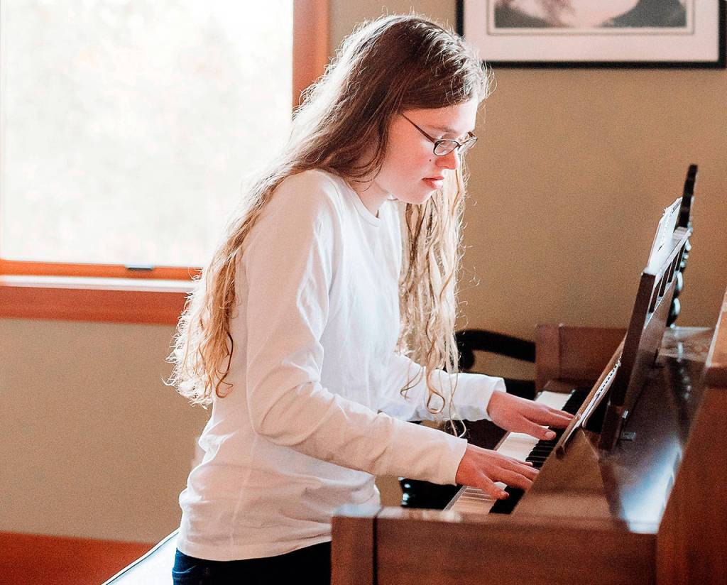 Emma Weller, a senior at Port Angeles High School, played Mozarts Sonata for piano, No. 11, K. 330.