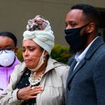 Marcia Carter-Patterson, center, mother of Manny Ellis, speaks at a press conference in front of the Pierce County Superior Court in Tacoma on Thursday, June 4, 2020, regarding the killing of her son by Tacoma police. At left is Mannys sister Monet Carter-Mixon and at right is his brother Matthew Ellis. Tacoma polices restraint of Manuel Ellis caused his death the medical examiner has reported. The community has been protesting the death that happened March 3, 2020, for the past week. (Ellen M. Banner/The Seattle Times via AP)