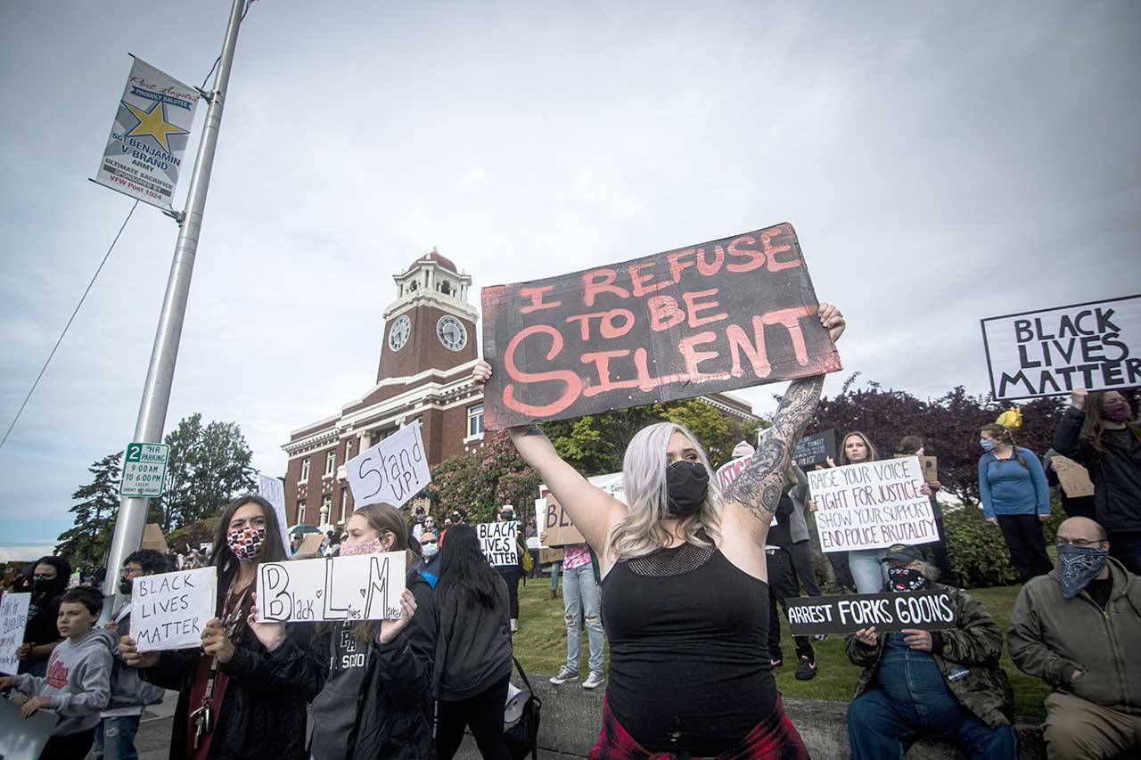 Kimberley Littlejohn holds a sign that says I refuse to be silent during the Black Lives Matter protest, attended by an estimated 600 people on Saturday at the Clallam County Courthouse in Port Angeles. (Jesse Major/for Peninsula Daily News)