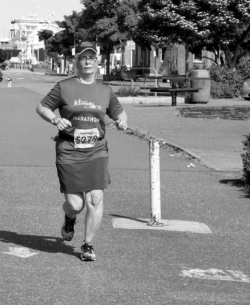 <strong>Dave Logan</strong>/for Peninsula Daily News                                Norma Humphreys of Tacoma starts her 5K run at the Port Angeles Pier on Sunday morning as part of the North Olympic Discovery Marathon virtual event.