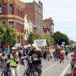 Ken Park/Peninsula Daily News A crowd of more than 1,000 people walk down South Water Street in Port Townsend during the Juneteenth celebration.