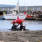 Ken Park/Peninsula Daily News                                JES Schumacher and her partner Jim celebrated the Fourth of July in a unique way by taking her son Kristian Breviks art piece out for a day on the water. Brevik is currently earning his doctorate in entomology in Vermont but has long been an artist in Port Townsend. Sparky the red orca affixed to this kayak, is made from fabric coated in marine lacquer and illuminated from the inside.