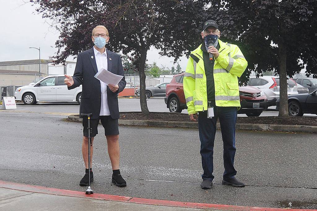 Sequim Mayor Will Armacost and Public Works Director David Garlington provide information about the West Fir Street Rehabilitation Project at a ceremony on July 9, 2020. (Michael Dashiell/Olympic Peninsula News Group)