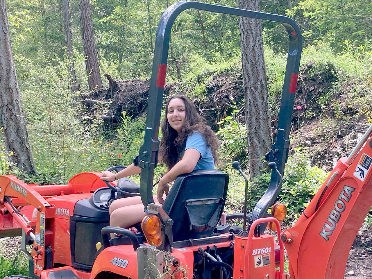 Chloe Lampert excavates an amphibian pond as part of her independent project for YES! Base Camp. (Judith Rubin/Northwest Watershed Institute)