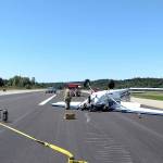 Firefighters from East Jefferson Fire Rescue tend to a plane that overturned on the runway at Jefferson County International Airport on Monday. (East Jefferson Fire Rescue)