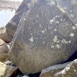 Ancient petroglyphs are seen at Wedding Rocks south of Cape Alava. (Rob Ollikainen/Peninsula Daily News)