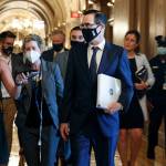 Treasury Secretary Steven Mnuchin , center, walks to a Republican luncheon Tuesday, July 21, 2020, while attending meetings on Capitol Hill in Washington. In the background at center left is White House Chief of Staff Mark Meadows. (Jacquelyn Martin/Associated Press)
