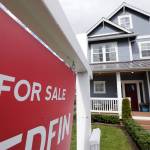 In this April 1, 2020, photo, a For Sale sign stands in front of a home that is in the process of being sold in Monroe, Wash., outside of Seattle. Americans stepped up their home purchases in June, clawing back some of the losses after the pandemic had caused sales to crater in the prior three months. (Elaine Thompson/Associated Press file)