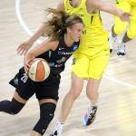 New York Liberty forward Sabrina Ionescu (20) drives past Seattle Storm forward Breanna Stewart (30) during the first half of a WNBA basketball game, Saturday, July 25, 2020, in Ellenton, Fla. (AP Photo/Phelan M. Ebenhack)