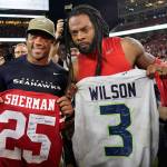 In this Monday, Nov. 11, 2019, photo, Seattle Seahawks quarterback Russell Wilson, left, exchanges jerseys with San Francisco 49ers cornerback Richard Sherman after an NFL football game in Santa Clara, Calif. NFL teams will be prohibited from postgame interactions within 6 feet of each other, so players wont be allowed to exchange jerseys after games as part of the guidelines to help limit the spread of the coronavirus.The restrictions are outlined in the game-day protocols finalized by the league and NFL Players Association on Wednesday, July 8, 2020. (Tony Avelar/Associated Press file)