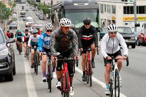 About 30 hardy cyclists from the Victoria area came across on the early Coho ferry Monday to ride up to the top of Hurricane Ridge on Canada Day, the anniversary of the 1867 effective date of the countrys constitution. The cyclists make the round trip in about 4 hours in time for the return ferry ride back home, including this group on First St. in Port Angeles. The yearly trek has been happening for about 20 years and is organized only by word of mouth through various cycle shops in the greater Victoria area.