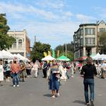 Shoppers visit vendor booths at the Port Townsend Farmers Market on Saturday. A regular at the Port Townsend market has committed to covering vendor fees at markets in Port Townsend and Chimacum to help struggling farmers and the market nonprofit. (Ken Park/Peninsula Daily News)