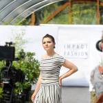 Sarah Shea of Sequim walks the runway to promote sustainable clothing lines through Impact Fashion. Photographers and videographers like Cindy Roth, right, will help compile footage and photos for the Sept. 4 debut of the fashion show as part of a two-day summit. (Matthew Nash/Olympic Peninsula News Group)