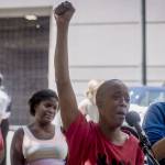Demetria Hester, center, speaks to the media after being released from the Multnomah County Justice Center on Monday, Aug. 10, 2020, in Portland, Ore. Hester became a leading activist in the racial justice movement after she was assaulted by a white supremacist three years ago. Authorities said Hester wont be charged following her arrest early Monday. Hester had been booked on suspicion of disorderly conduct and interfering with a police officer during the protest that began Sunday night. Hesters arrest drew a sharp rebuke from national Black Lives Matter activists, who are increasingly focusing on demonstrations in Oregons largest city. (Brooke Herbert/The Oregonian via AP)