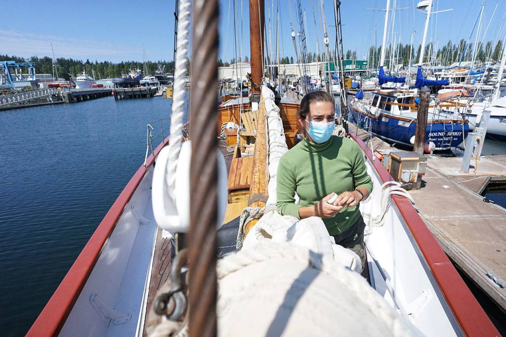 Capt. Katelinn Shaw stands aboard the docked Schooner Adventuress on Thursday afternoon at Port Townsend Boat Haven. (Nicholas Johnson/Peninsula Daily News)
