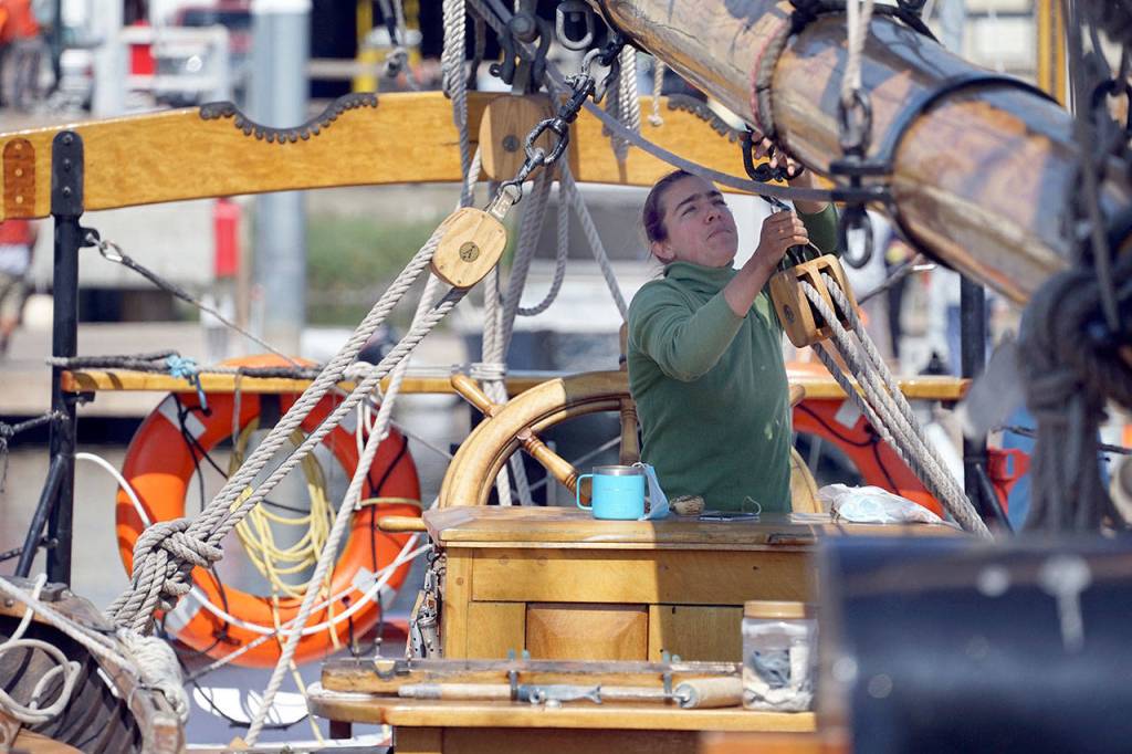 Capt. Katelinn Shaw works to prepare the Schooner Adventuress for Fridays shakedown sail Thursday afternoon while docked at Port Townsend Boat Haven. (Nicholas Johnson/Peninsula Daily News)