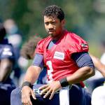 Seattle Seahawks quarterback Russell Wilson stretches before NFL football training camp, Friday, Aug. 14, 2020, in Renton, Wash. (AP Photo/Ted S. Warren)