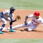Los Angeles Angels Shohei Ohtani, right, steals second base next to Seattle Mariners second baseman Dee Gordon during the first inning Sunday in Anaheim, Calif. (AP Photo/Marcio Jose Sanchez)