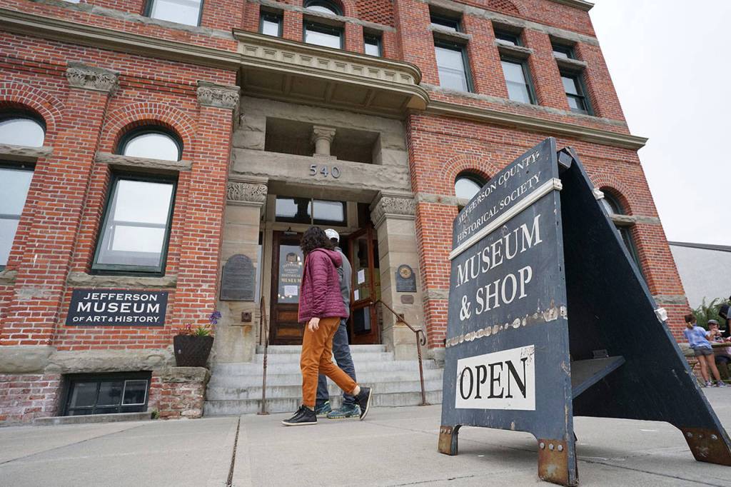 A sidewalk sign outside the Jefferson Museum of Art & History announces that the museum is open Saturday after six months of closure due to the coronavirus pandemic. The museum sits along Water Street in the same building that houses Port Townsend City Hall. (Nicholas Johnson/Peninsula Daily News)