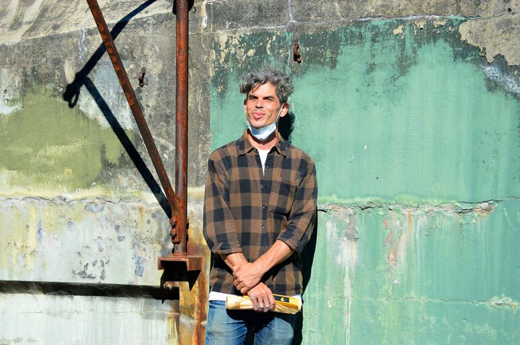 Centrum artist in residence Aaron Asis spent the past week finishing the Fort Words installation. (Photo by Diane Urbani de la Paz/for Peninsula Daily News)