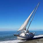 A non-commercial sailboat has been stranded on the Dungeness Spit since the evening of Friday, Aug. 28. Photo by Chad Kaiser