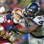 Tony Avelar/The Associated Press San Francisco 49ers quarterback Jimmy Garoppolo, left, avoids being sacked by Seattle Seahawks defensive end Jadeveon Clowney (90) in Santa Clara, Calif., in November 2019. The Tennessee Titans announced Sunday that they had signed Clowney.                                San Francisco 49ers quarterback Jimmy Garoppolo, left, avoids being sacked by Seattle Seahawks defensive end Jadeveon Clowney (90) in Santa Clara, Calif., in November 2019. The Tennessee Titans announced Sunday that they had signed Clowney. (Tony Avelar/The Associated Press)