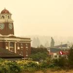 The Clallam County Courthouse sits wrapped in a heavy layer of smoke and fog Saturday morning. (Dave Logan/For Peninsula Daily News)