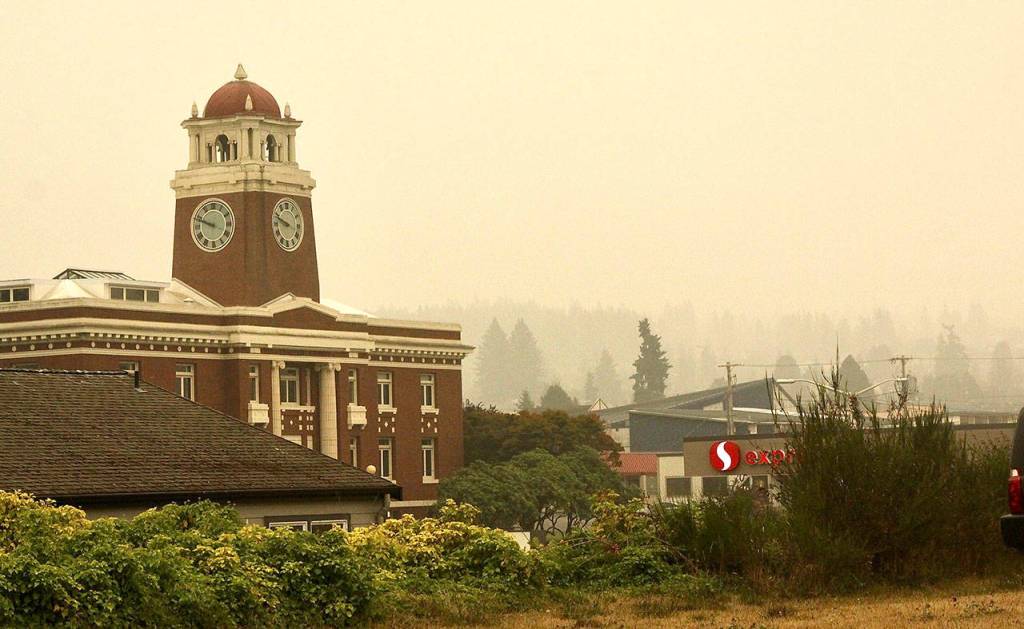 The Clallam County Courthouse sits wrapped in a heavy layer of smoke and fog Saturday morning. (Dave Logan/For Peninsula Daily News)