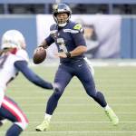 Seattle Seahawks quarterback Russell Wilson looks to pass against the New England Patriots during the first half of an NFL football game, Sunday, Sept. 20, 2020, in Seattle. (AP Photo/Elaine Thompson)