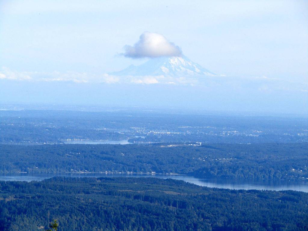 A cloud forms on Mount Rainier. (Rob Ollikainen/Peninsula Daily News)