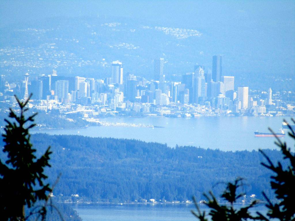 Downtown Seattle appears through the trees from Mount Walkers south viewpoint Sunday, Sept. 20, 2020. (Rob Ollikainen/Peninsula Daily News)