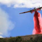 Cal Fire air tankers help stop the spread of a brush fire in Larkfield, Calif., on Thursday, Sept. 24, 2020. (Kent Porter/The Press Democrat via AP)