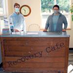 Recovery Cafe Program Manager Brian Richardson, left, along with volunteer and advisory committee member Maura Walsch, stand behind the welcome desk of the Recovery Cafe on Tuesday as the pair and other volunteers worked to finish the last pieces of the cafes renovations. (Zach Jablonski/Peninsula Daily News)