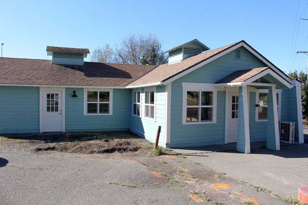 The exterior of the Recovery Cafe on the corner of Kearney and Blaine streets was repainted from black to the now light blue and white during its renovations. (Zach Jablonski/Peninsula Daily News)