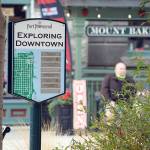 An outdated merchant information sign at the corner of Taylor and Water streets in downtown Port Townsend includes a plaque for retailer Sport Townsend, which has been closed since early 2017. (Nicholas Johnson/Peninsula Daily News)