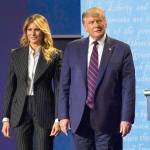 President Donald Trump stands on stage with first lady Melania Trump after the first presidential debate with Democratic presidential candidate former Vice President Joe Biden on Tuesday at Case Western University and Cleveland Clinic in Cleveland, Ohio. (Julio Cortez/Associated Press)