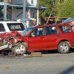 Keith Thorpe/Peninsula Daily NewsRescue workers attend to one of several vehicles involved in a collision at U.S. Highway 101 and North Larch Avenue east of Port Angeles on Tuesday afternoon that snarled westbound traffic.