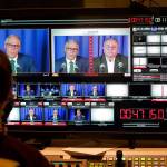 Washington gubernatorial candidates Gov. Jay Inslee, a Democrat, center-left, and Loren Culp, a Republican, center-right, are shown on a monitor in a video control room at the studios of TVW, Wednesday, Oct. 7, 2020, in Olympia, Wash., as they take part in a debate. Due to concerns over COVID-19, each candidate took part in the debate from individual rooms separate from moderators. (AP Photo/Ted S. Warren)