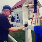 From left, volunteer work crew members Bill Bjorklund, Melody Monson and Sarah Miller add some new paint at the New Dungeness Lighthouse this summer. Photo Julie Bacher