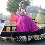 From left, royalty prince Logan Laxson, princess Brii Hingtgen, princess Alicia Pairadee and queen Lindsey Coffman wave to a virtual crowd on Sequim-Dungeness Way during the Sequim Irrigation Festival's makeshift Grand Parade on Saturday. (Michael Dashiell/Olympic Peninsula News Group)
