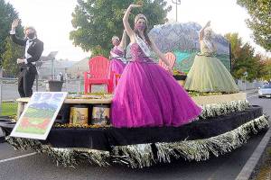 From left, royalty prince Logan Laxson, princess Brii Hingtgen, princess Alicia Pairadee and queen Lindsey Coffman wave to a virtual crowd on Sequim-Dungeness Way during the Sequim Irrigation Festival's makeshift Grand Parade on Saturday. (Michael Dashiell/Olympic Peninsula News Group)