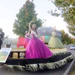 From left, royalty prince Logan Laxson, princess Brii Hingtgen, princess Alicia Pairadee and queen Lindsey Coffman wave to a virtual crowd on Sequim-Dungeness Way during the Sequim Irrigation Festivals makeshift Grand Parade on Saturday. (Michael Dashiell/Olympic Peninsula News Group)