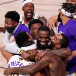 The Los Angeles Lakers LeBron James (23) celebrates with his teammates after the Lakers defeated the Miami Heat 106-93 in Game 6 of basketballs NBA Finals Sunday in Lake Buena Vista, Fla. (Mark J. Terrill/Associated Press)