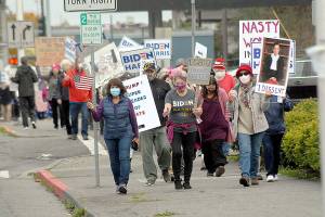Keith Thorpe/Peninsula Daily NewsMarchers celebrating the legacy of the late Supreme Court Justice Ruth Bader Ginsberg make their way up Lincoln Street to the Clallam County Courthouse after a procession through downtown Port Angeles on Saturday. A crowd of nearly 300 people took part in the demonstration, which also served as a protest of the policies of President Donald Trump..