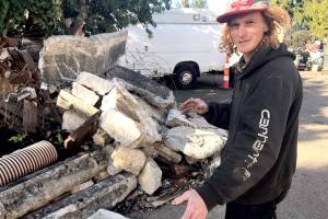 Paul Gottlieb/Peninsula Daily NewsCody Coughenour was continuing his cleanup Tuesday of three properties on East Fifth Street.