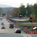 Vehicles travel in both directions Thursday evening along therecently completed state Highway 116 bridge between Indian andMarrowstone islands. Nicholas Johnson/Peninsula Daily News